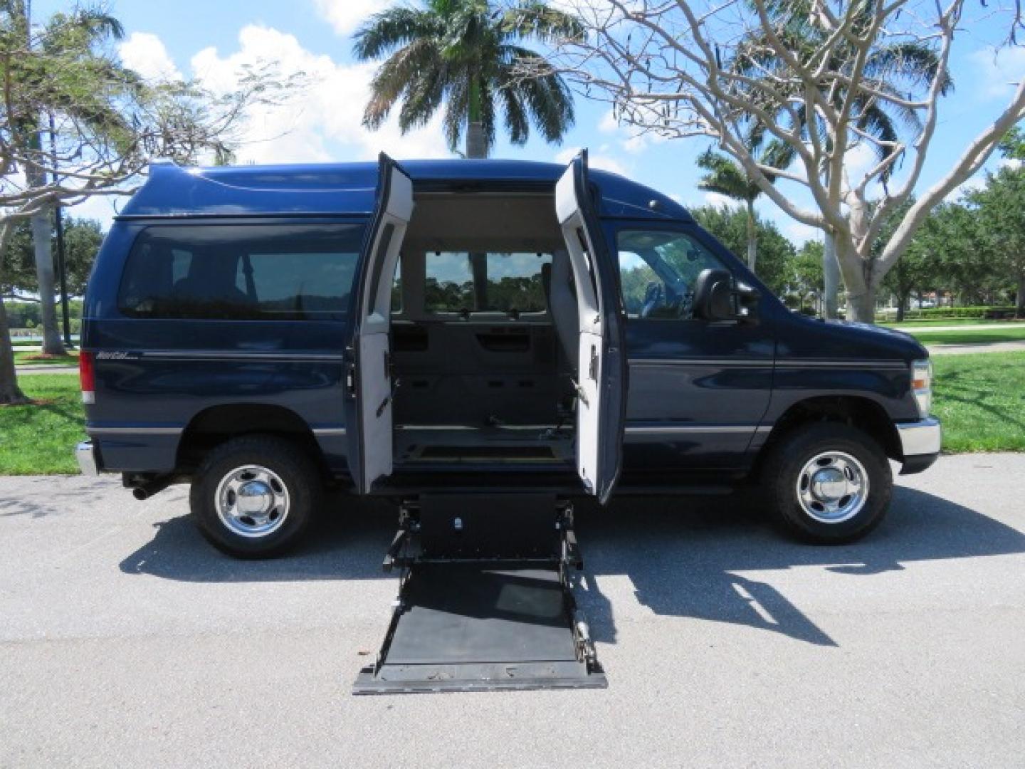 2011 Dark Blue /Gray Ford E-Series Wagon E-350 XLT Super Duty (1FBNE3BS4BD) with an 6.8L V10 SOHC 20V engine, located at 4301 Oak Circle #19, Boca Raton, FL, 33431, (954) 561-2499, 26.388861, -80.084038 - You are looking at a Gorgeous 2011 Ford Econoline E350 XLT Norcal Max High Top Handicap Wheelchair Conversion Van with 6.8L V10, 15K Original Miles, 9 Inch Lowered Floor, Braun UVL Side Entry Wheelchair Lift, Remote Control Power Side Entry Doors, Expanded Side Entry Doors, Q Straint Tie Down, Syste - Photo#48